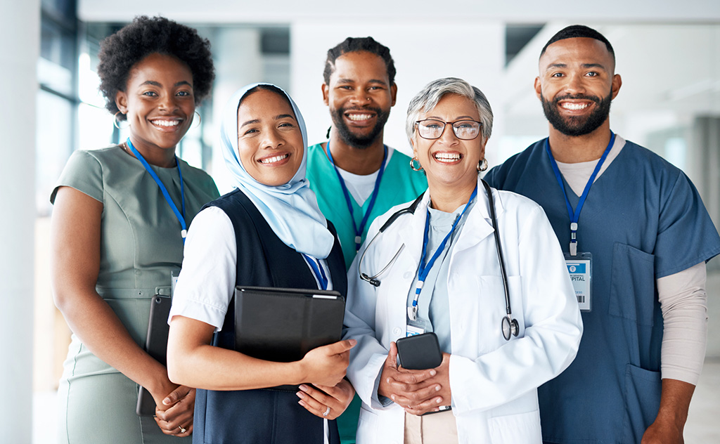 Portrait, Diversity And Happy Team Of Doctors With Teamwork Excited, Positive And Proud In A Hospital Or Clinic. Group, Healthcare Professional And Medicine Or Medical Experts In Unity Together