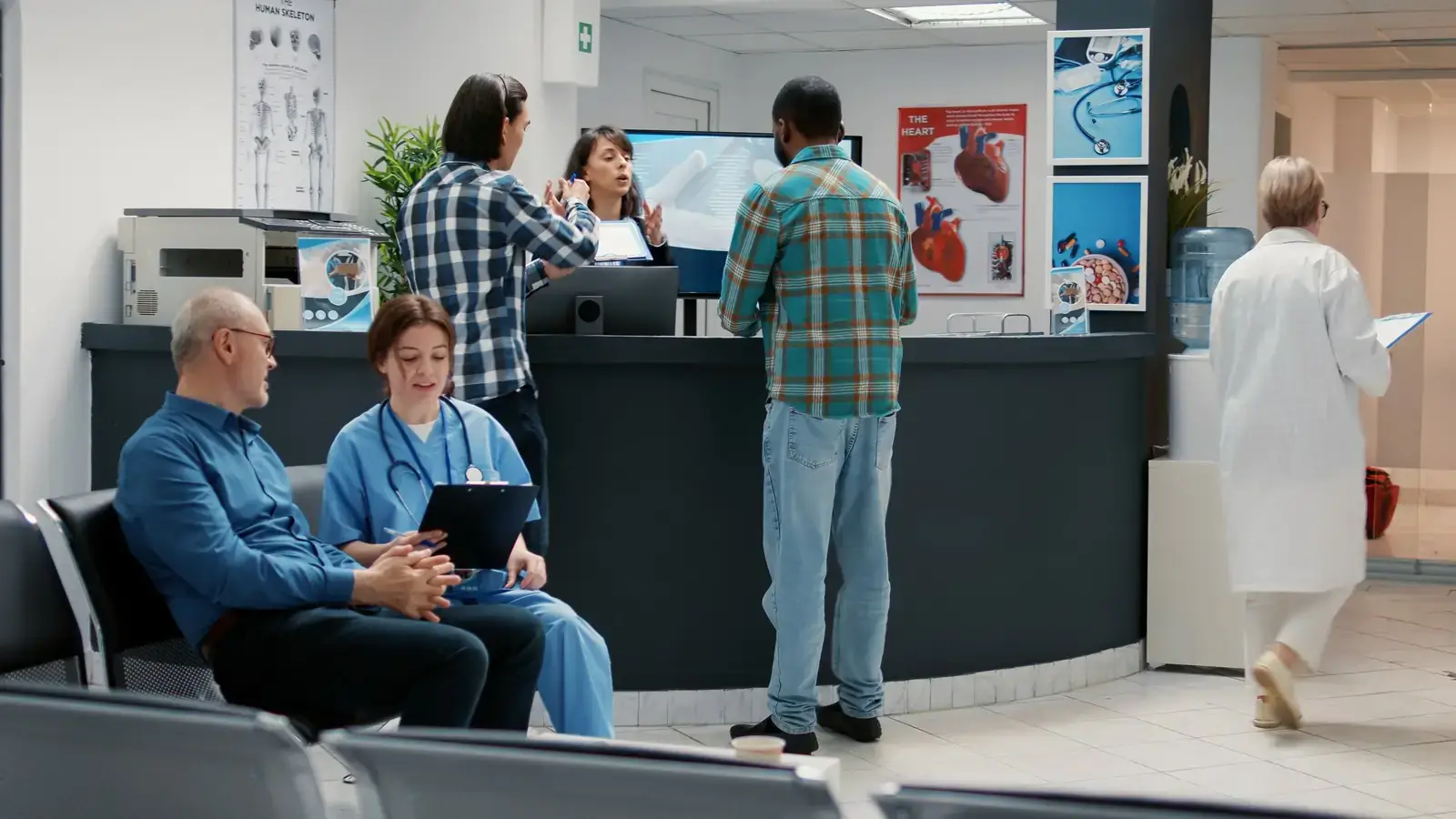 Patients checking in at a busy hospital reception desk