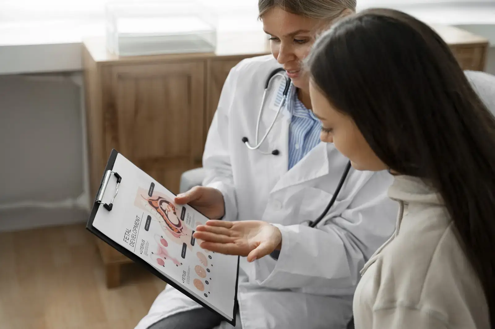 Clinician explaining a care plan to a patient during a consultation